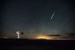 A meteor streaks above one of the antennas of the Very Large Array near Socorro, New Mexico. The image was captured as part of the Skyglow project, to raise awareness about light pollution.