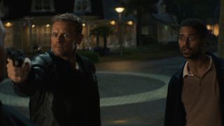 Danny, with gun in hand, and Pete on the street in The Couple Next Door episode 5.