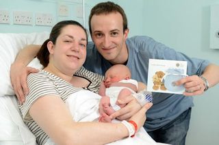 Marc and Beverley Miell with their newborn, born within minutes of the royal baby