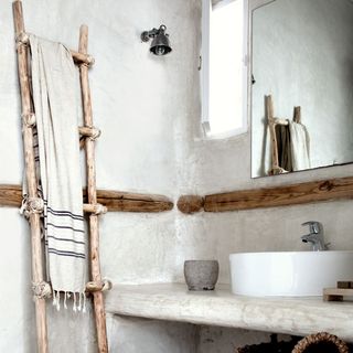 bathroom with ladder and washbasin with mirror