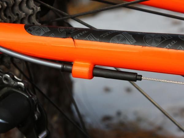 The rear section of derailleur housing is protected from contamination with a sealed end cap.
