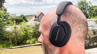 Bowers & Wilkins PX7 S2 worn by our reviewer outside 