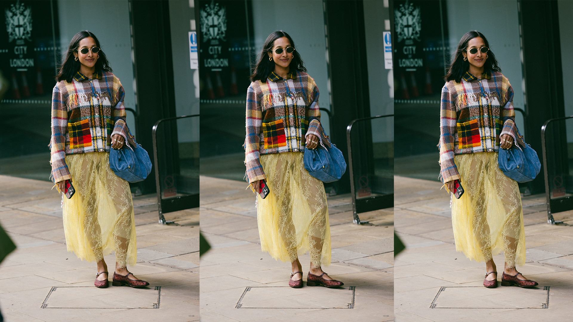 Woman wears plaid jacket, denim handbag, yellow sheer lace skirt, and mesh flats. 