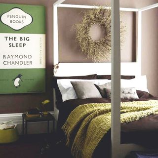 living room with bed and penguin book picture frame