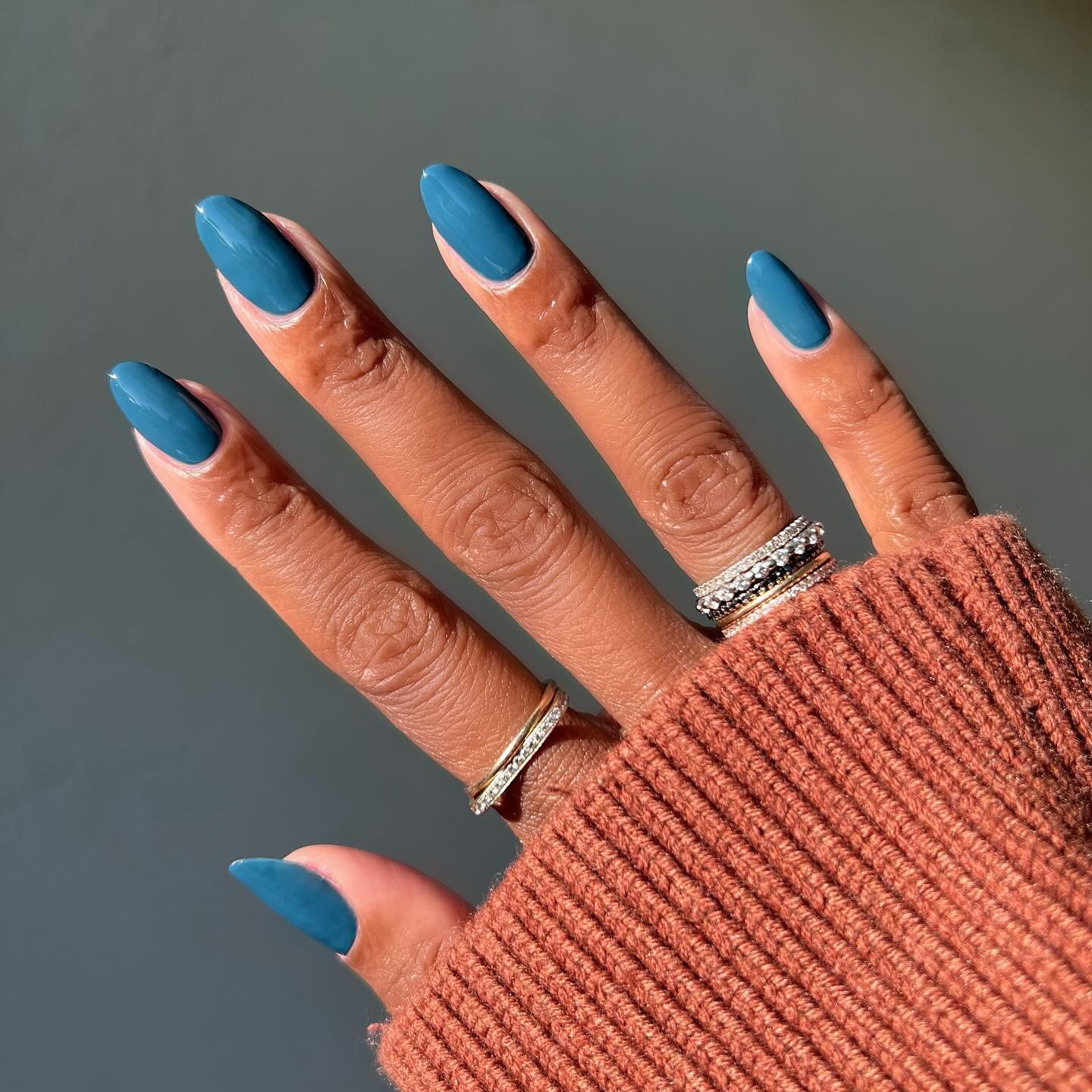 Stormy teal nails.