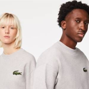 Man and woman wearing grey Lacoste sweatshirts