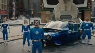 The cast of The Fantastic Four: First Steps exiting a car and looking up at the sky
