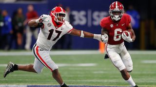 Trey Sanders #6 of the Alabama Crimson Tide carries the ball as Nakobe Dean #17 of the Georgia Bulldogs defends during the second half of the SEC Championship game at Mercedes-Benz Stadium on Dec. 4, 2021 in Atlanta, Georgia.