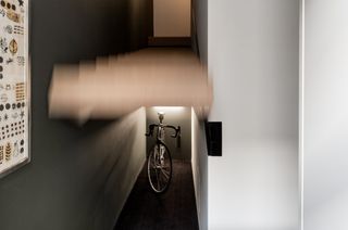 Hidden bike storage under staircase
