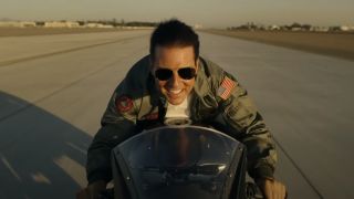 Pete "Maverick" Mitchell (Tom Cruise) rides to Top Gun in Top Gun: Maverick