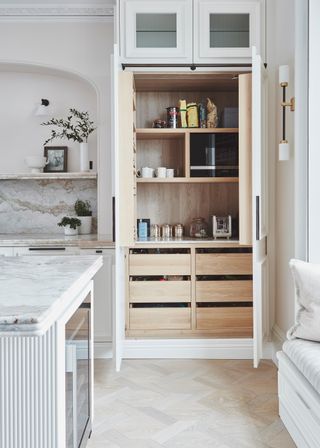 A kitchen with a large, in-built breakfast cabinet