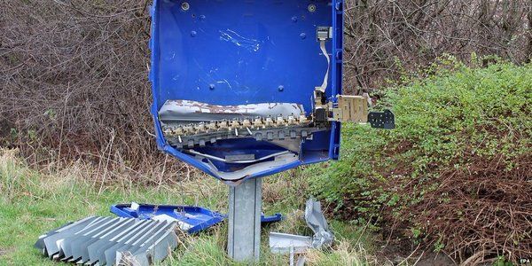 The destroyed condom vending machine.