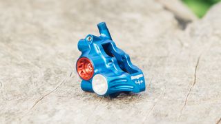 A red white and blue brake calliper