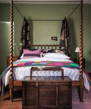 Traditional green bedroom with four poster bed