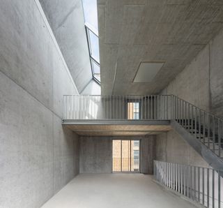Empty interior of concrete build and stairs to the right
