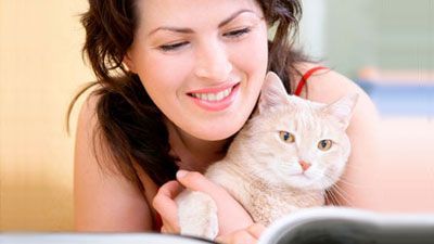 woman reading with cat