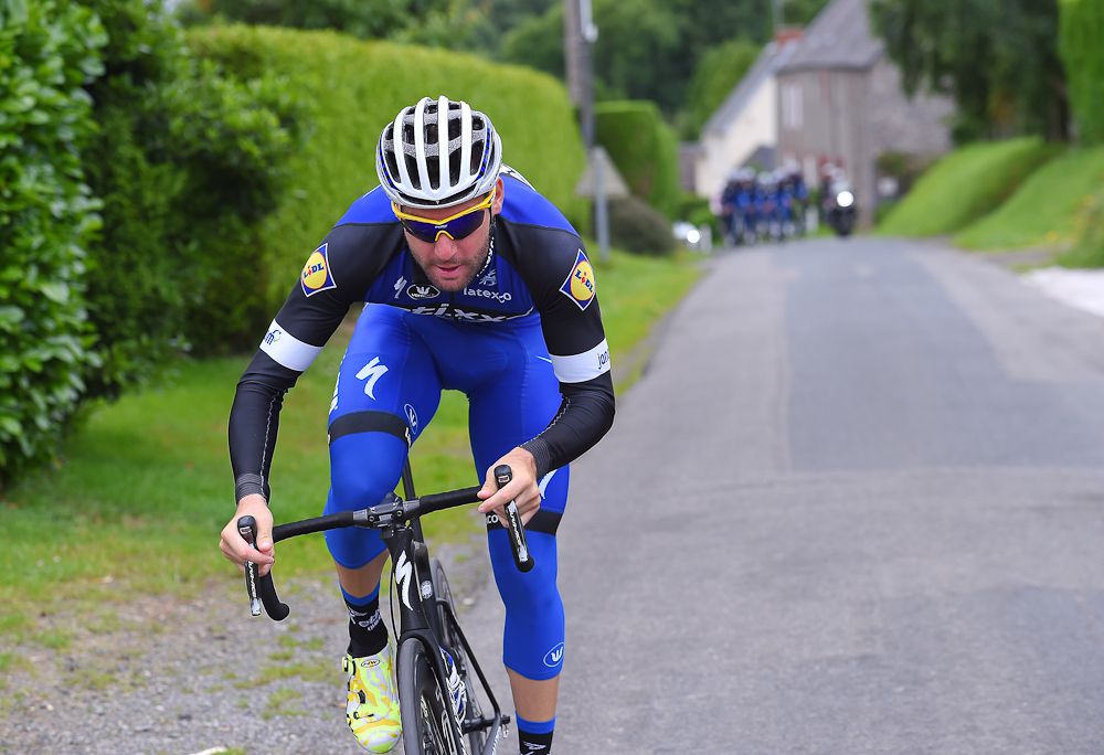 Fabio Sabatini stretches his legs during the Etixx-QuickStep training ride.
