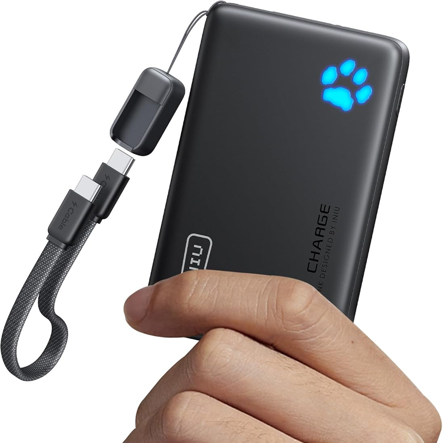 Iniu P50-E1 battery pack with paw print LED held in hand