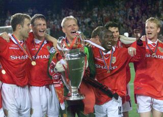 Manchester United players celebrate with the Champions League trophy after their late comeback to beat Bayern Munich in the 1999 Champions League final at Camp Nou.