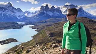 best fleece jackets: hiker wearing fleece jacket and shades