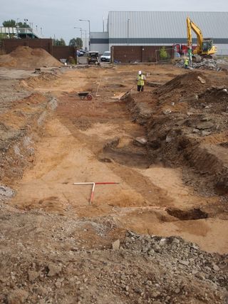 A view of the linear ditch running obliquely through the excavated Roman site.