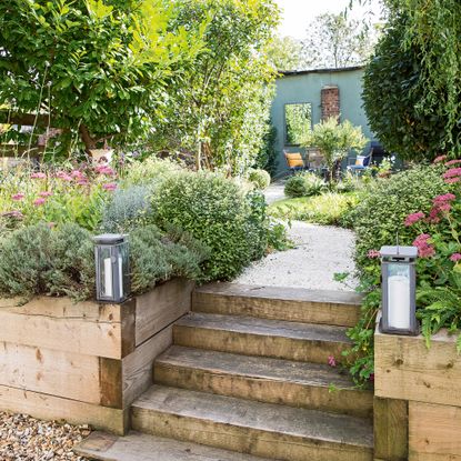 Garden with railway sleeps creating steps and raised beds