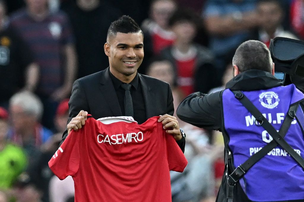 Transfer deadline day: Manchester United&#039;s Brazilian midfielder Casemiro is photographed with a United shirt as he is introduced to supporters ahead of the English Premier League football match between Manchester United and Liverpool at Old Trafford in Manchester, north west England, on August 22, 2022. 