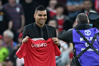 Transfer deadline day: Manchester United's Brazilian midfielder Casemiro is photographed with a United shirt as he is introduced to supporters ahead of the English Premier League football match between Manchester United and Liverpool at Old Trafford in Manchester, north west England, on August 22, 2022. 