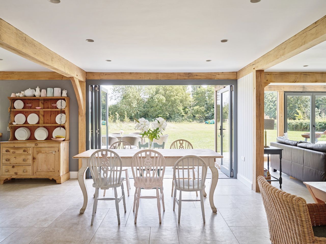 dining table in oak frame home with view to garden