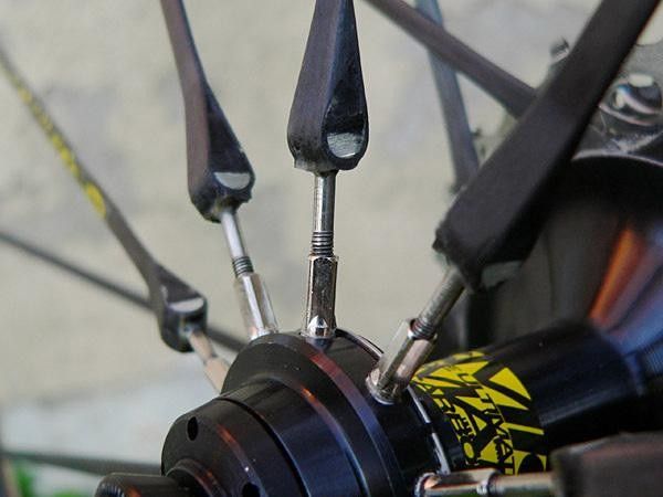 Mavic includes adjustable spokes on the non-driveside of the rear wheel to allow for minor truing.