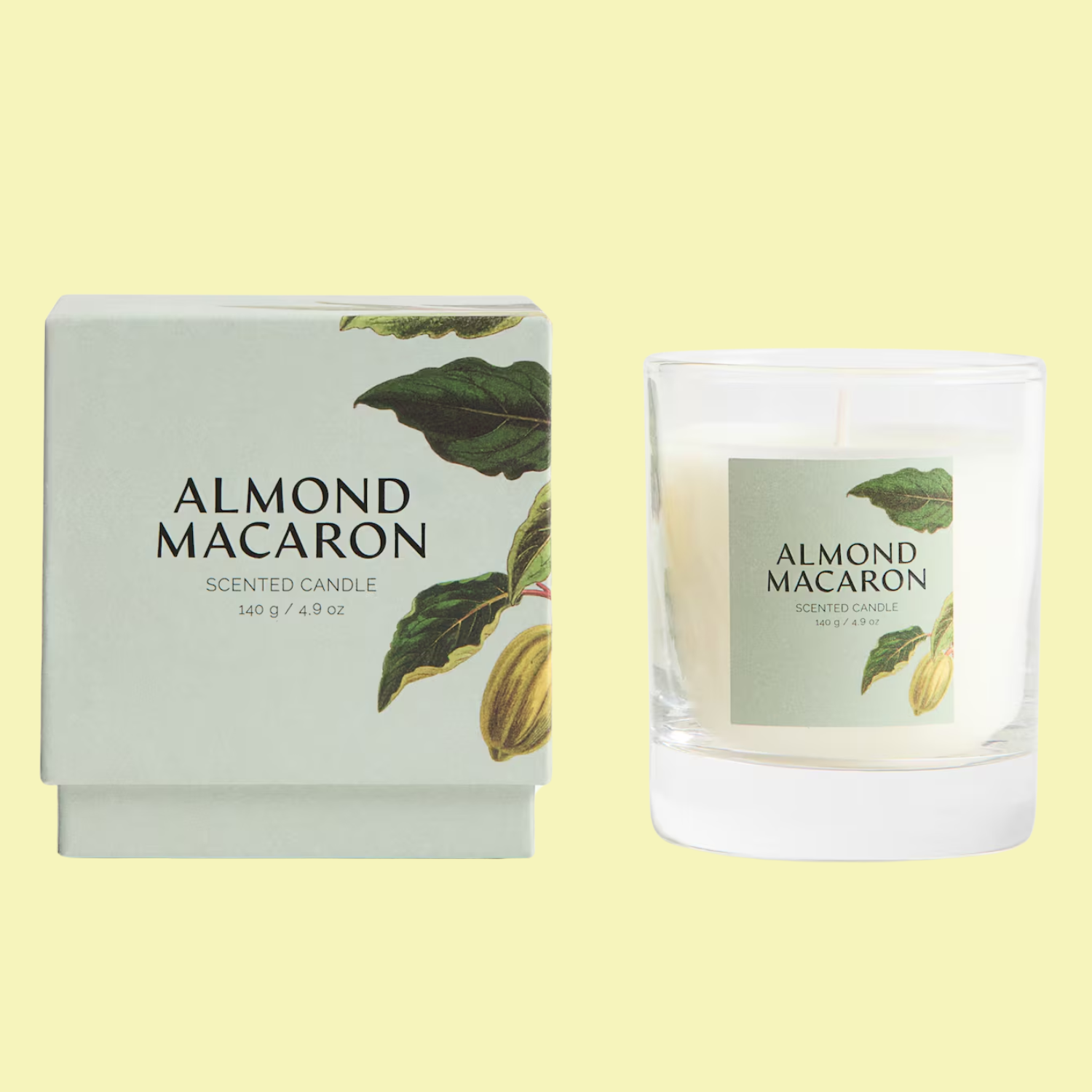 A scented candle in a white glass beside a box