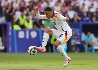 Jamal Musiala in action for Germany against Spain at Euro 2024.