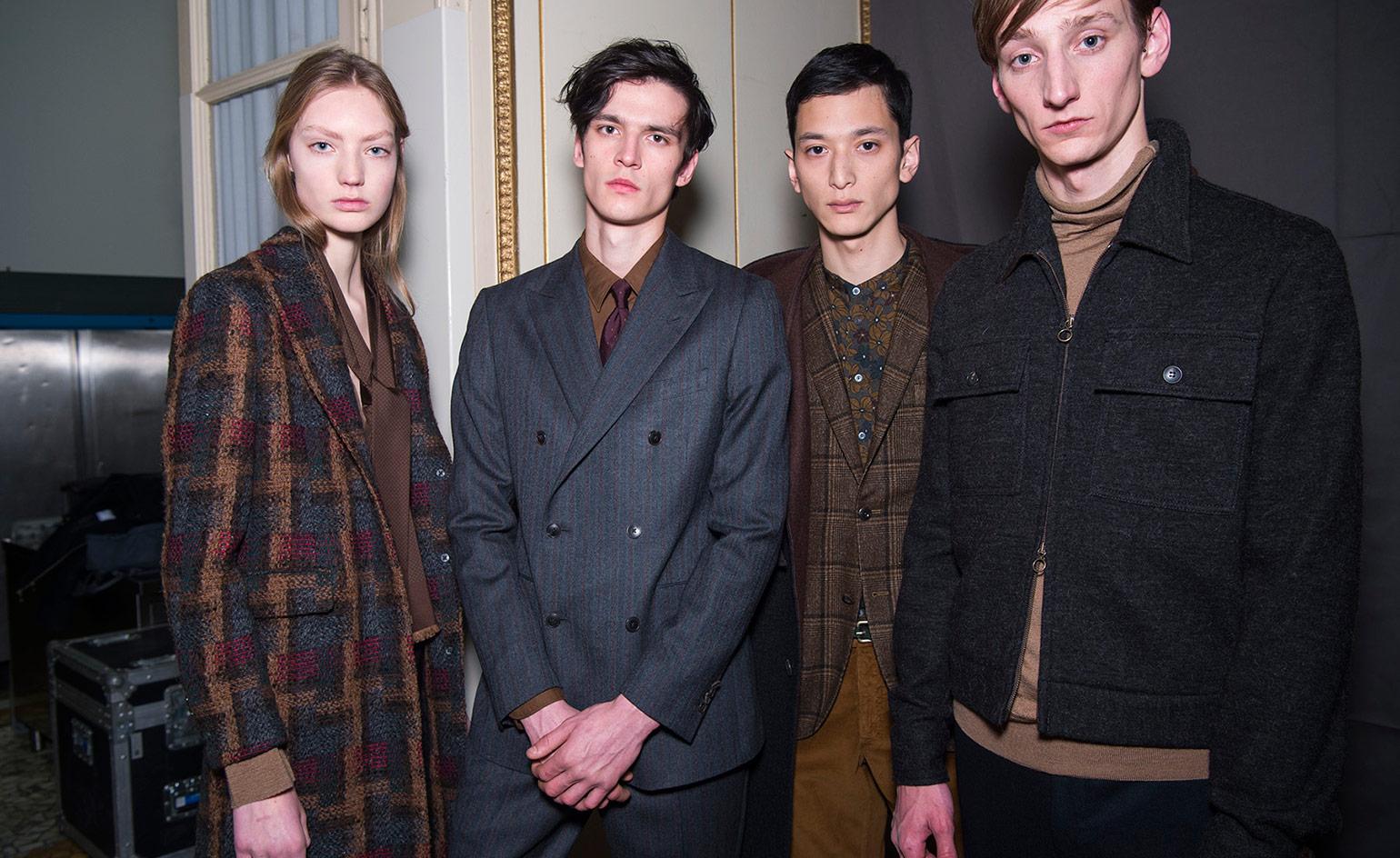 3 male models & 1 female model look into the camera