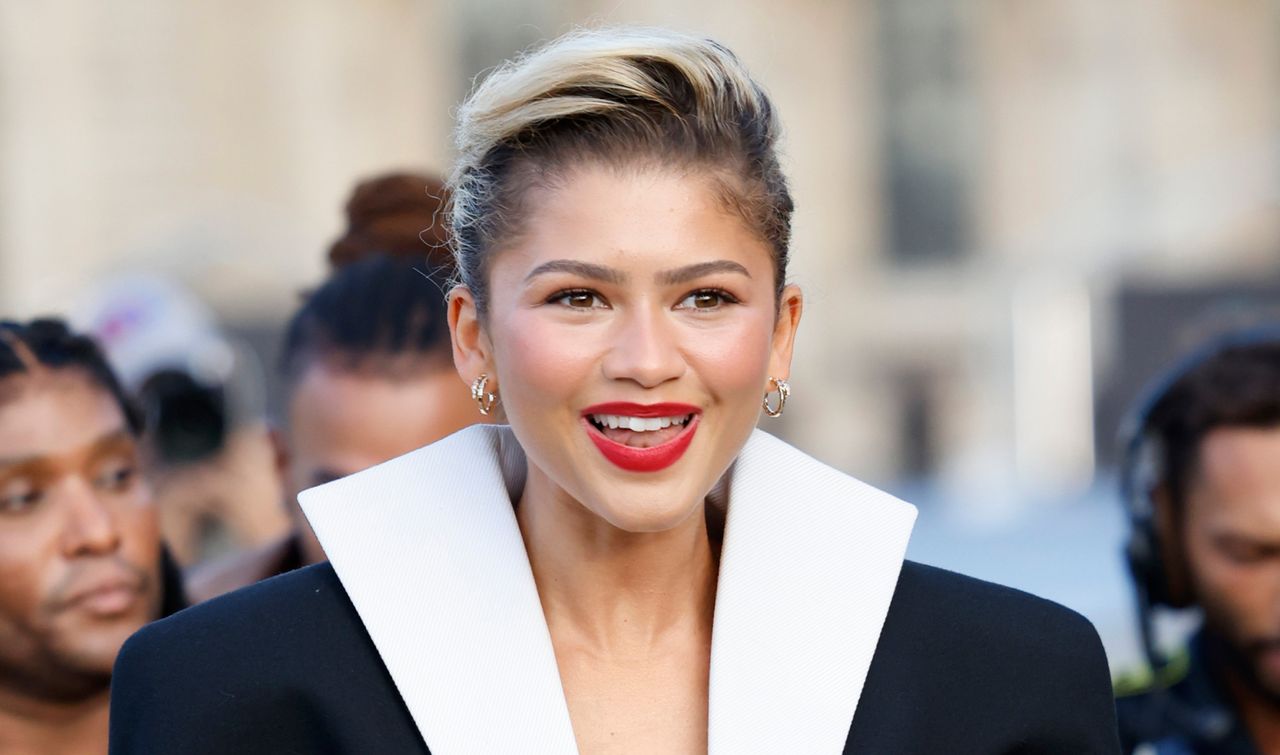 Zendaya at the Louis Vuitton Spring 2024 fashion show in bold red lipstick