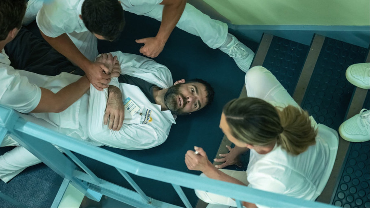 Zachary Quinto as Wolf being drugged in Brilliant Minds' Season 2 premiere flash forward