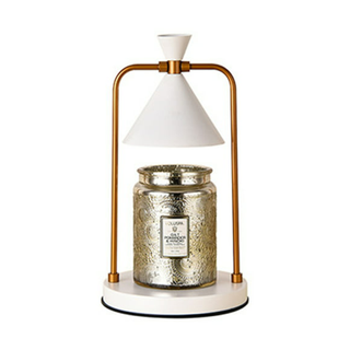A white and copper industrial candle warmer lamp 