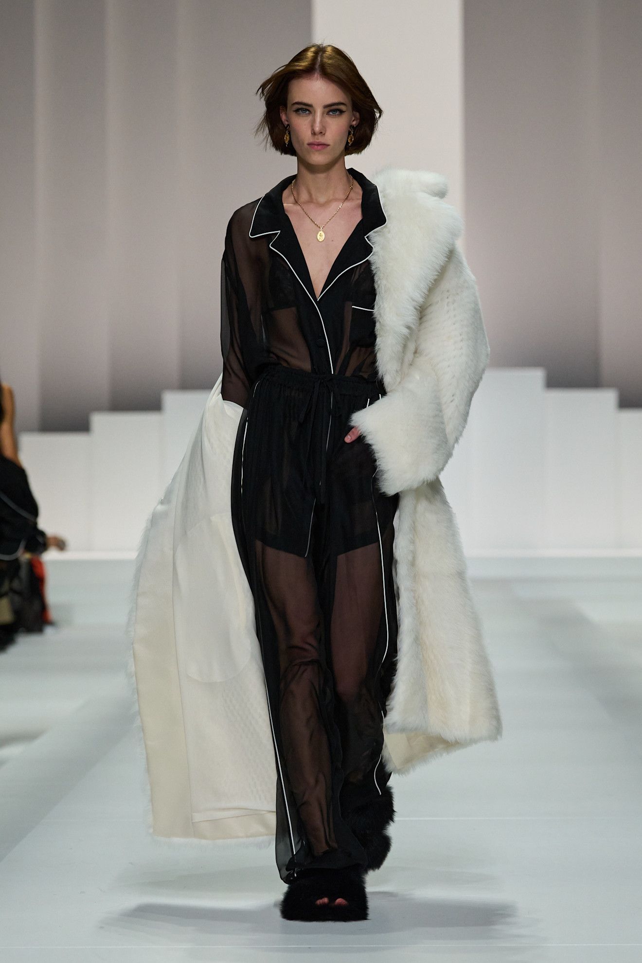 Women on dolce & Gabbana runway show wearing pajama-inspired outfits.