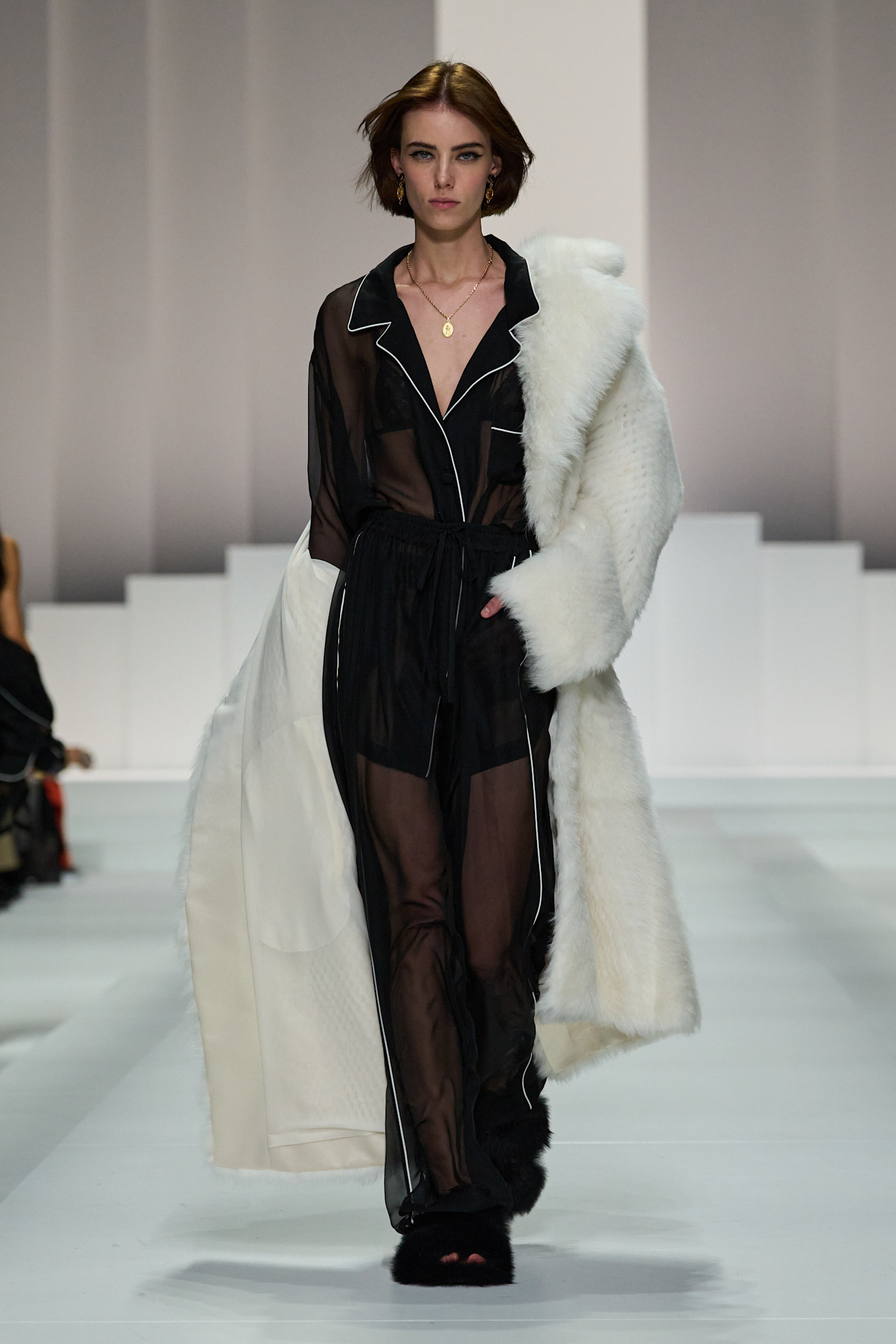 Women on dolce &amp;amp; Gabbana runway show wearing pajama-inspired outfits.