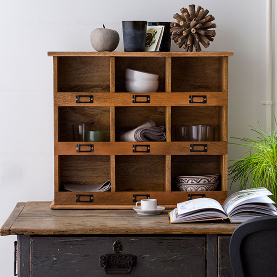 wooden storage cubby units on wooden drawer top