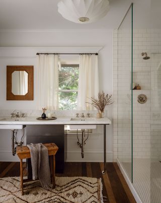a bathroom with a sink in front of a window