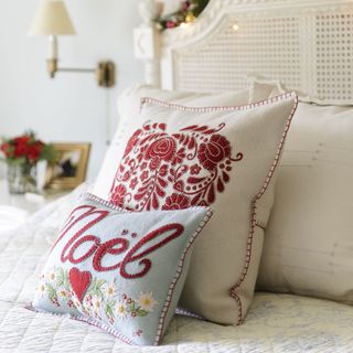 bedroom decorantion with designer cushions and throw
