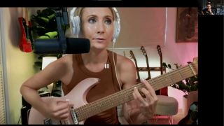 Screenshot of a video guitar lesson with Caitlin Caggiano