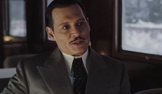 Johnny Depp as Ratchett in Murder on the Orient Express