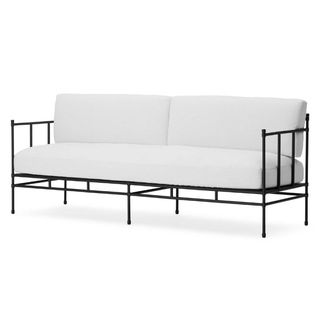 White cushioned sofa with black framing