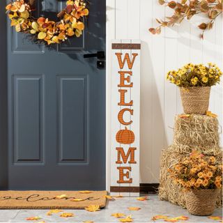 Fall porch with welcome sign, fall florals and wreath