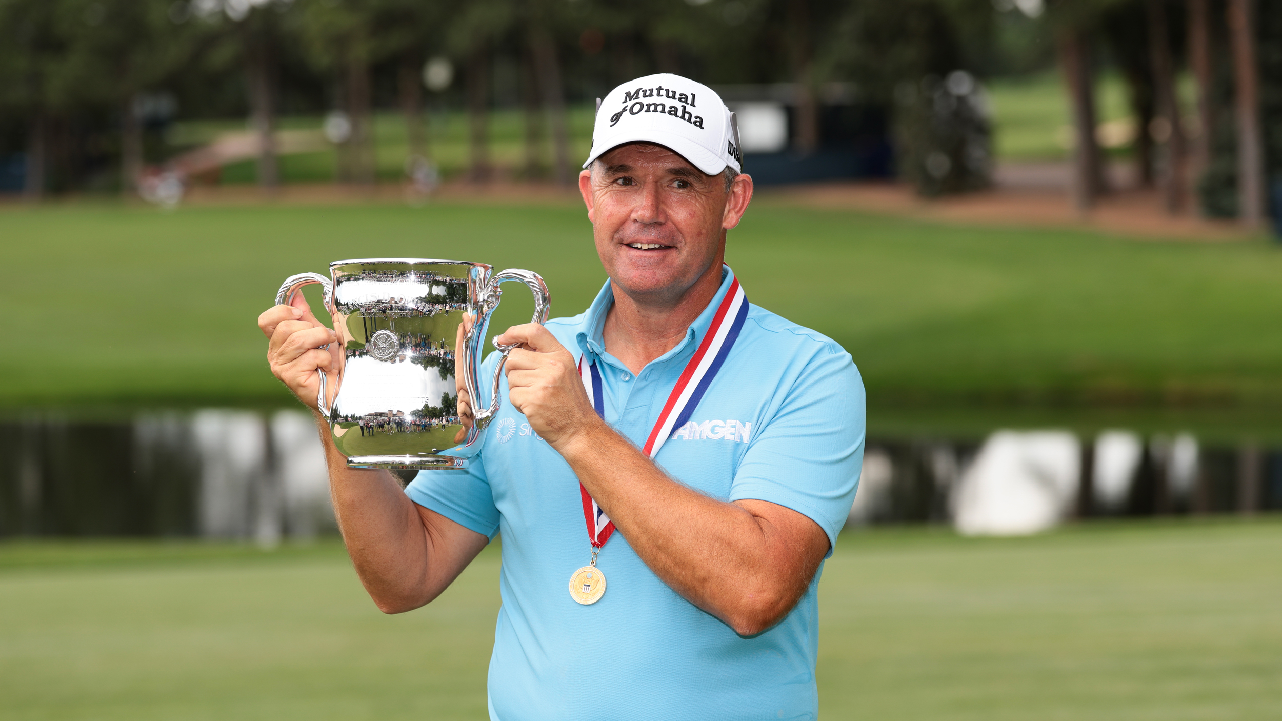 Padraig Harrington holds up the US Senior Open trophy after winning at Broadmoor Golf Club in 2025