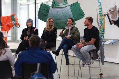 A panel of speakers at a Canada Goose event