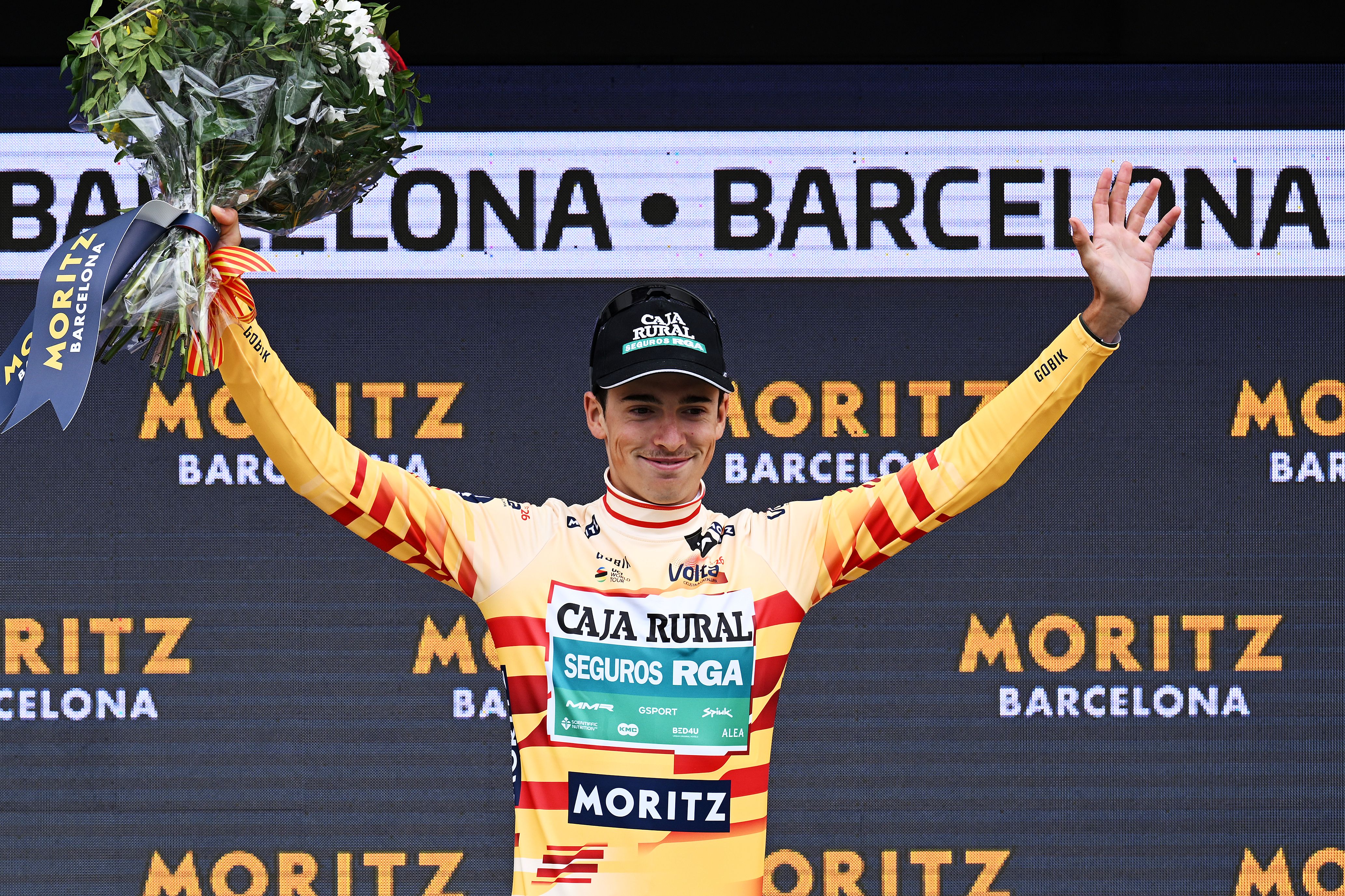 BARCELONA, SPAIN - MARCH 29: Jan Castellon of Spain and Team Caja Rural - Seguros RGA celebrates at podium as best Catalan Jersey during the 105th Volta a Catalunya 2026, Stage 7 a 95.1km stage from Barcelona to Barcelona / #UCIWT / on March 29, 2026 in Barcelona, Spain. (Photo by Szymon Gruchalski/Getty Images)