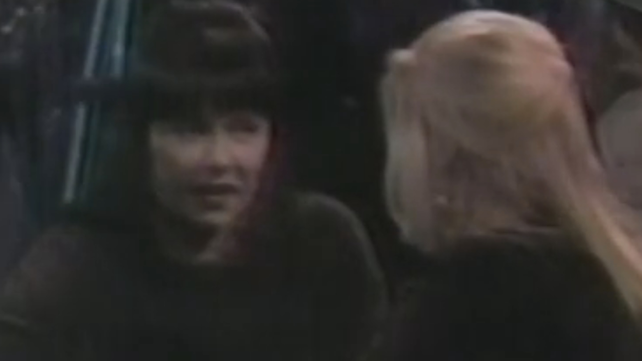 Roseanne Barr as Roseanne Conner with a lesbian at a bar on Roseanne