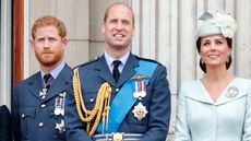 Prince Harry, Duke of Sussex, Prince William and Catherine, Princess of Wales watch a flypast to mark the centenary of the Royal Air Force from the balcony of Buckingham Palace on July 10, 2018